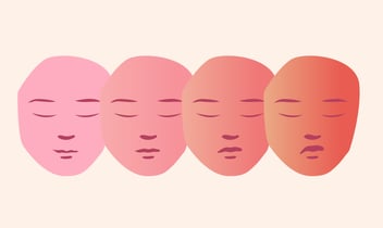 a row of five different colored faces 