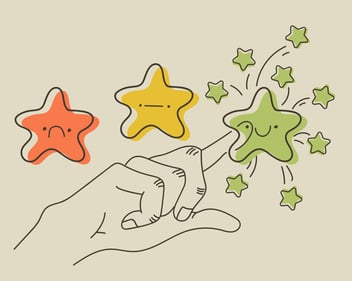 a hand chooses a happy green star 