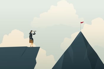 businesswoman looking through a spyglass at a red flag on top of a mountain