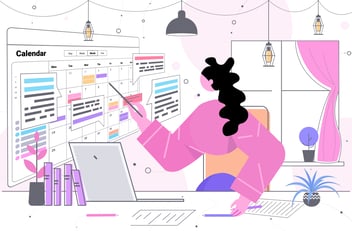 woman tapping on her calendar on the wall