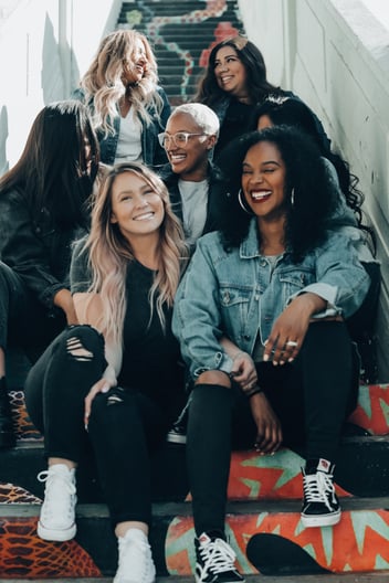 Group of women sitting on stairs