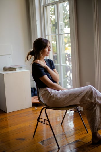 woman sitting on chair 