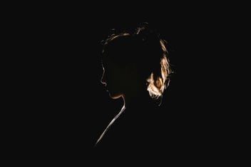 a dark silhouette of a woman