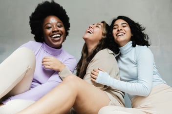 three women laughing 