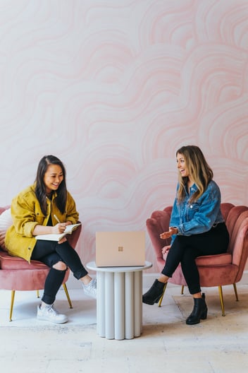 women talking in a meeting