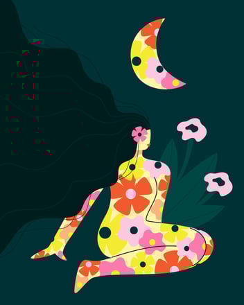 a woman sitting on her knees colored in by bright flowers